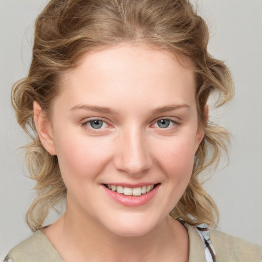 Joyful white young-adult female with medium  brown hair and blue eyes