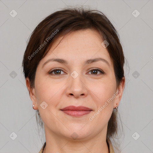 Joyful white adult female with medium  brown hair and brown eyes