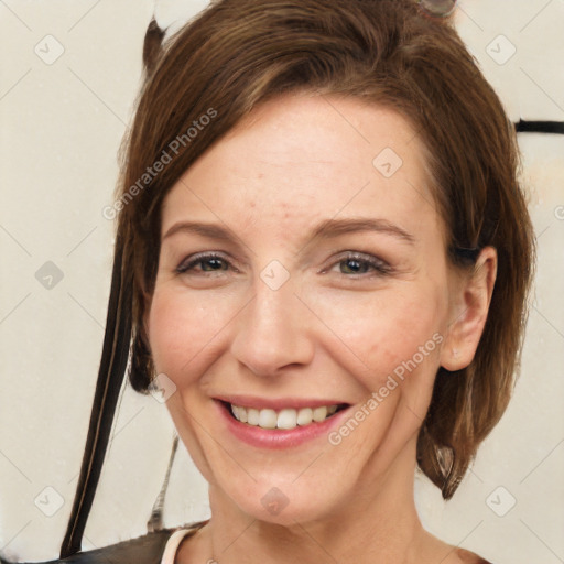 Joyful white adult female with short  brown hair and brown eyes