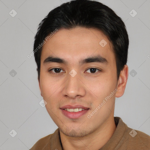 Joyful asian young-adult male with short  black hair and brown eyes