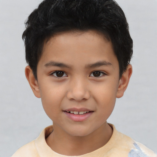 Joyful asian child male with short  brown hair and brown eyes