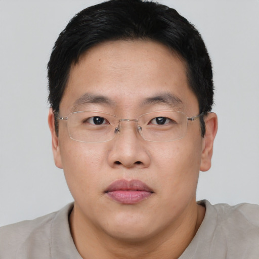 Neutral asian adult male with short  brown hair and brown eyes