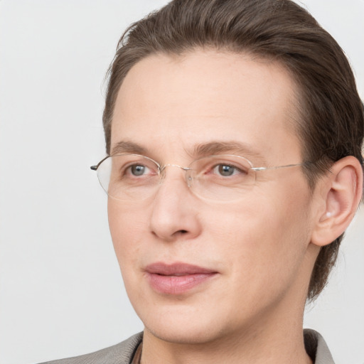 Joyful white adult male with short  brown hair and grey eyes