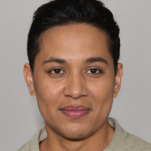 Joyful latino young-adult female with short  brown hair and brown eyes
