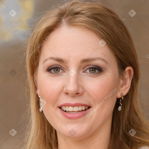 Joyful white adult female with long  brown hair and green eyes