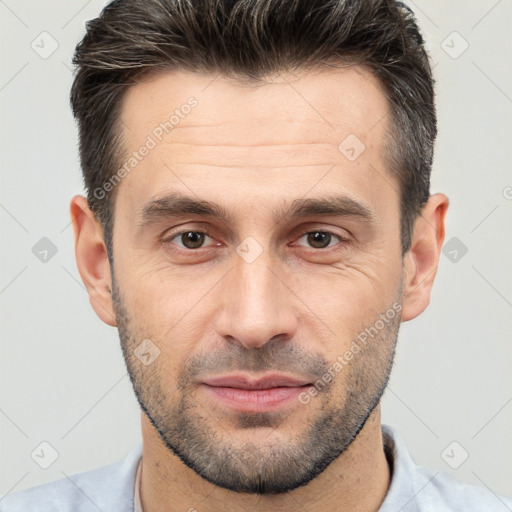 Joyful white adult male with short  brown hair and brown eyes