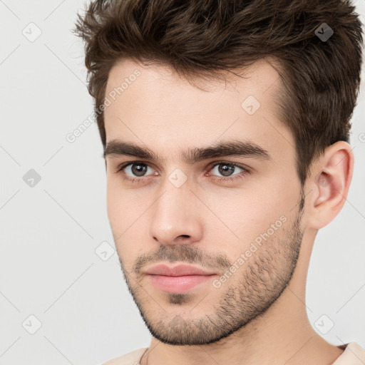 Neutral white young-adult male with short  brown hair and brown eyes