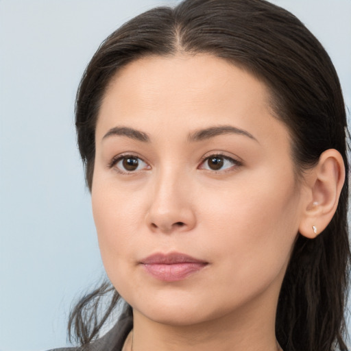 Neutral white young-adult female with long  brown hair and brown eyes