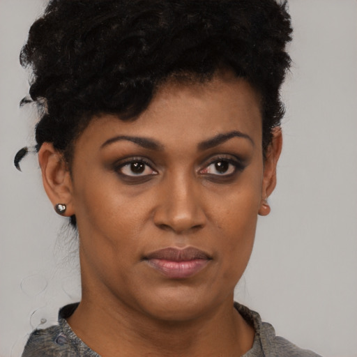 Neutral black young-adult female with short  black hair and brown eyes