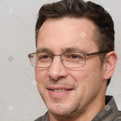 Joyful white adult male with short  brown hair and grey eyes