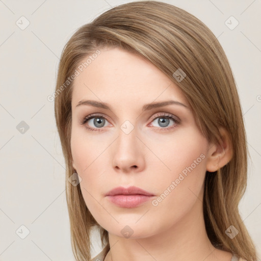 Neutral white young-adult female with long  brown hair and green eyes