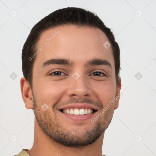 Joyful white young-adult male with short  brown hair and brown eyes