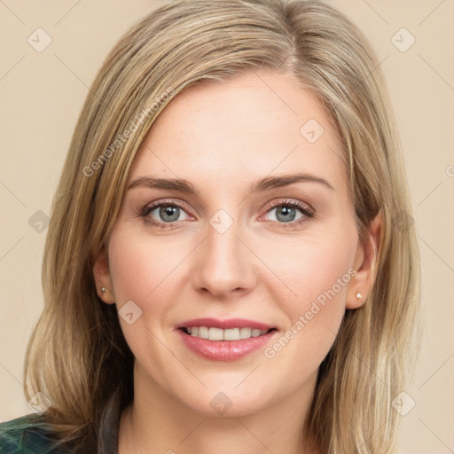 Joyful white young-adult female with medium  brown hair and green eyes