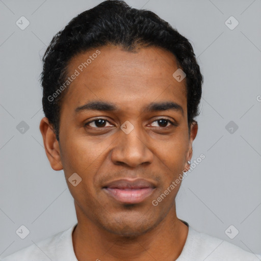 Joyful black young-adult male with short  black hair and brown eyes