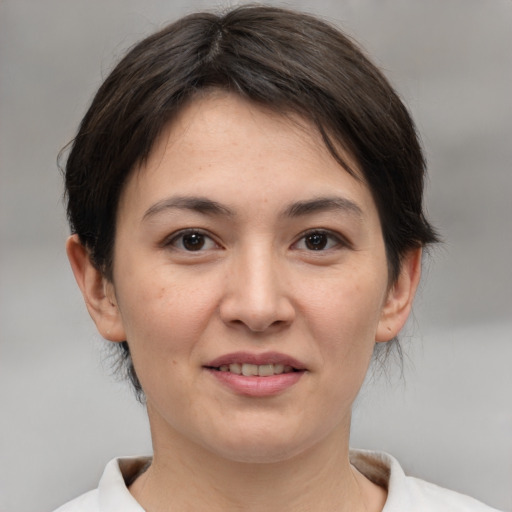 Joyful white young-adult female with medium  brown hair and brown eyes