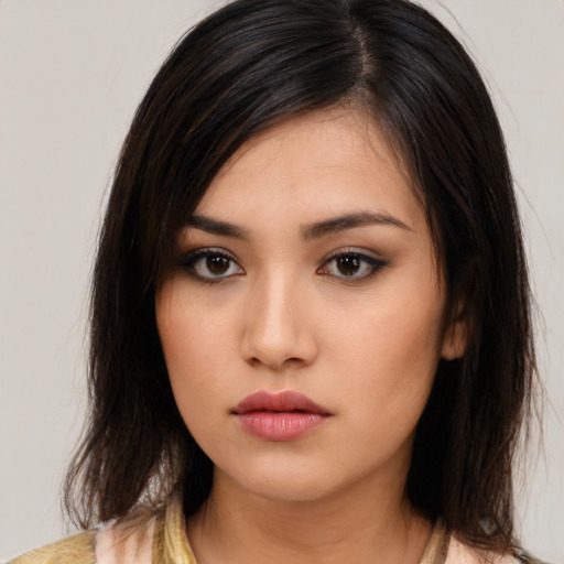 Neutral asian young-adult female with medium  brown hair and brown eyes