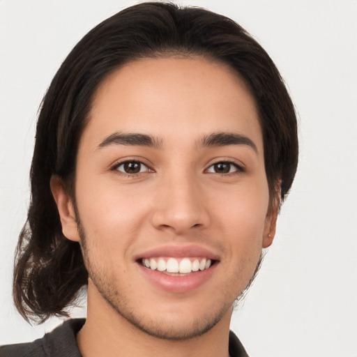 Joyful white young-adult male with medium  brown hair and brown eyes