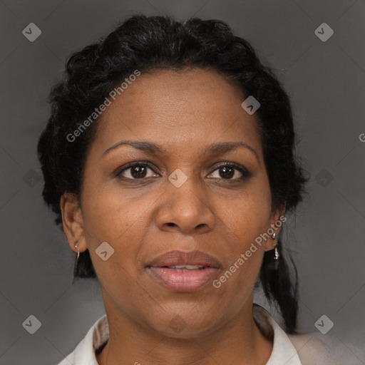 Joyful black adult female with short  brown hair and brown eyes