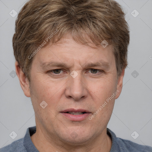 Joyful white adult male with short  brown hair and grey eyes