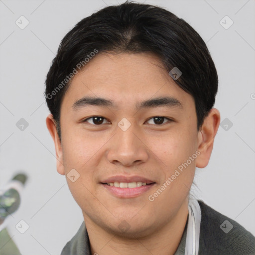 Joyful asian young-adult male with short  brown hair and brown eyes