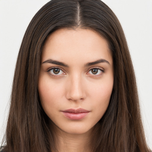 Neutral white young-adult female with long  brown hair and brown eyes