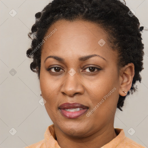 Joyful black adult female with short  brown hair and brown eyes