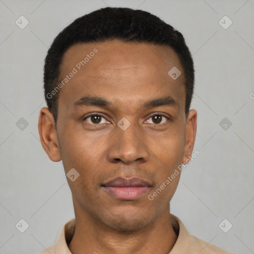 Joyful black young-adult male with short  black hair and brown eyes