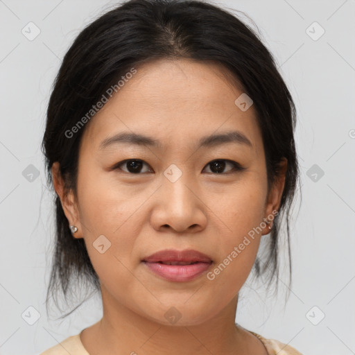 Joyful asian young-adult female with medium  brown hair and brown eyes