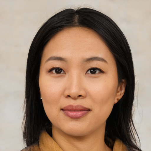 Joyful asian young-adult female with medium  black hair and brown eyes