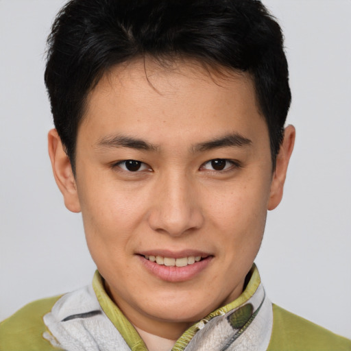 Joyful asian young-adult male with short  brown hair and brown eyes