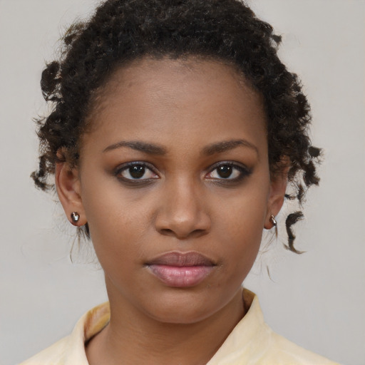Neutral black young-adult female with short  brown hair and brown eyes