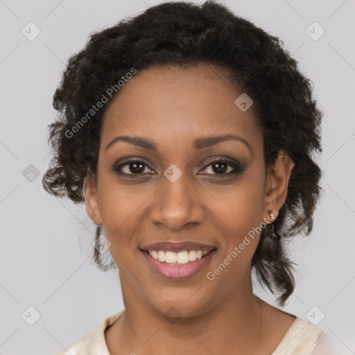 Joyful black young-adult female with long  brown hair and brown eyes