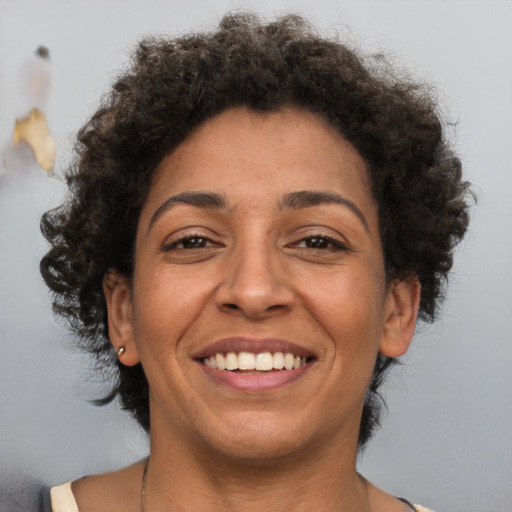 Joyful white adult female with short  brown hair and brown eyes