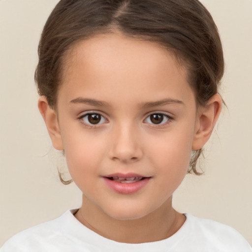 Joyful white child female with short  brown hair and brown eyes