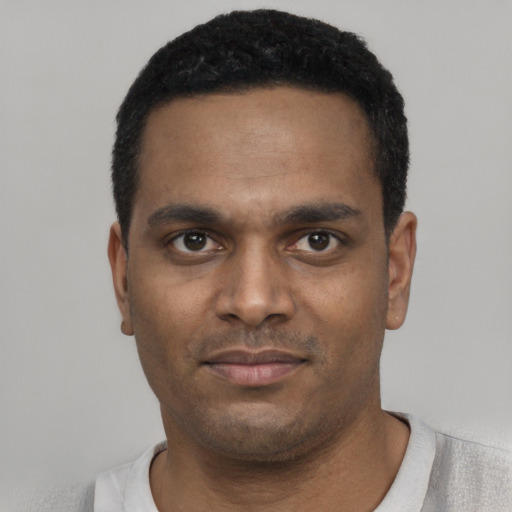 Neutral black young-adult male with short  black hair and brown eyes