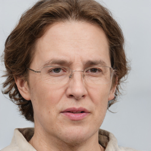 Joyful white adult male with medium  brown hair and green eyes