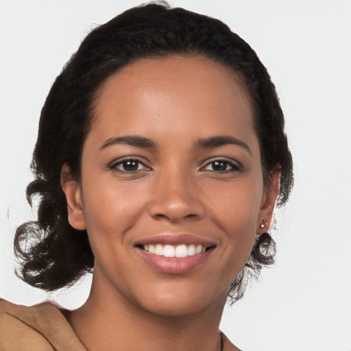 Joyful latino young-adult female with medium  brown hair and brown eyes