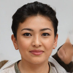 Joyful asian young-adult female with short  brown hair and brown eyes