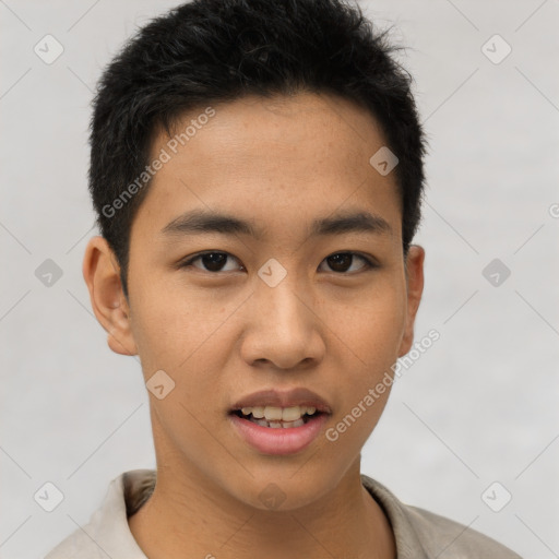 Joyful asian young-adult male with short  brown hair and brown eyes