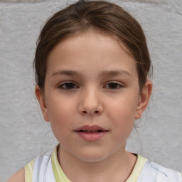 Joyful white child female with short  brown hair and brown eyes