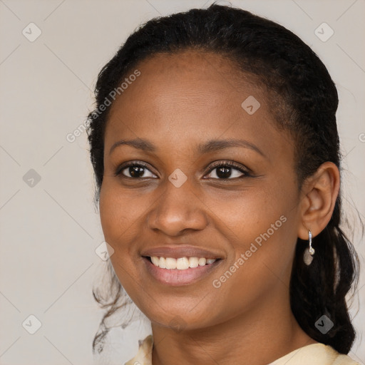 Joyful black young-adult female with medium  brown hair and brown eyes