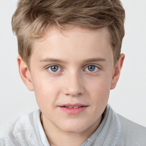 Joyful white child male with short  brown hair and grey eyes