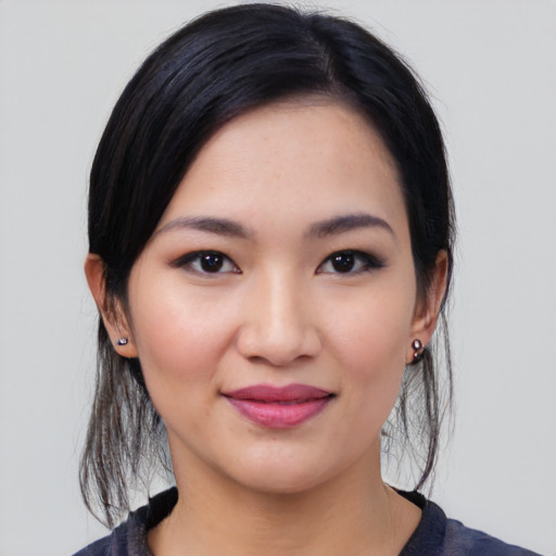 Joyful white young-adult female with medium  black hair and brown eyes