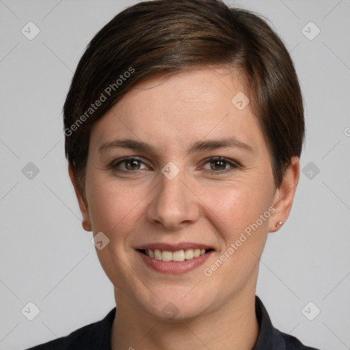 Joyful white young-adult female with short  brown hair and grey eyes