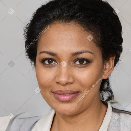 Joyful black young-adult female with medium  black hair and brown eyes