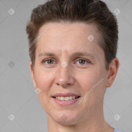 Joyful white adult female with short  brown hair and brown eyes