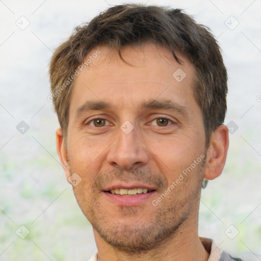 Joyful white adult male with short  brown hair and brown eyes