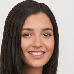 Joyful white young-adult female with long  black hair and brown eyes