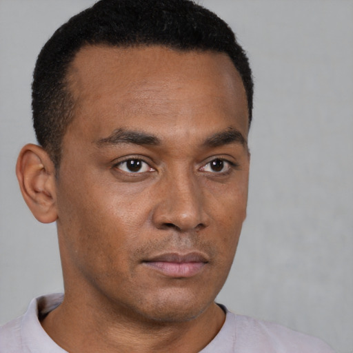Neutral black young-adult male with short  brown hair and brown eyes