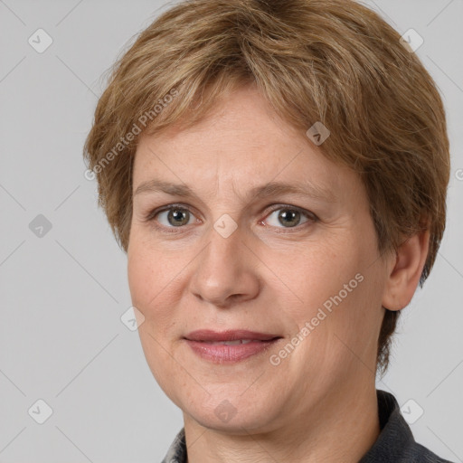 Joyful white adult female with medium  brown hair and grey eyes